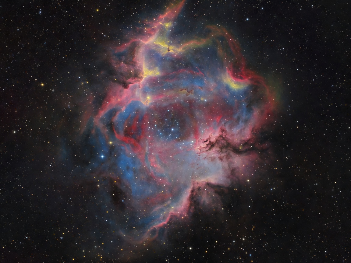 Deep sky image showing a nebula and surrounding star field